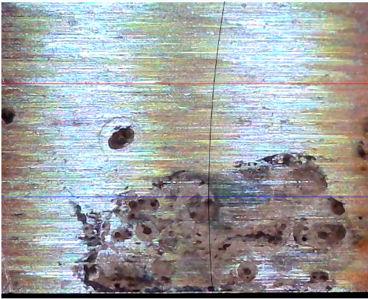 Deep rust leaves pits and missing steel in the blade surface.